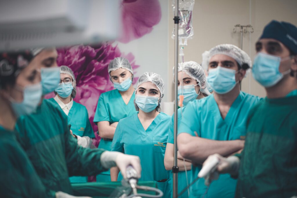 Medical team in Baku operating room during laparoscopic procedure.
